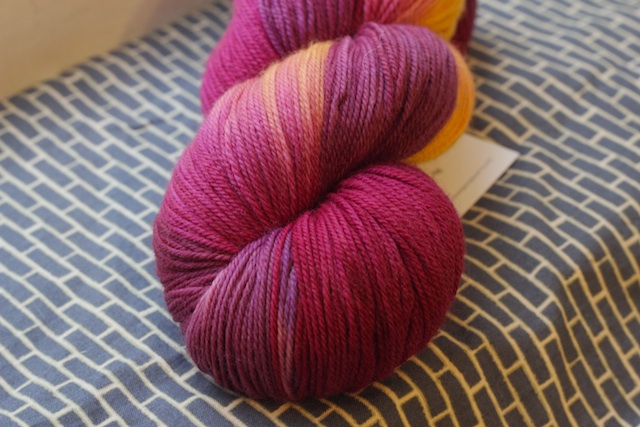 SweetGeorgia Tough Love Sock in Honey Fig. It's more purple than pink (despite this picture) and even though it isn't remotely like what I normally go for, I could not resist. 