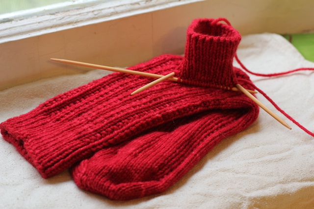 My mum asked for red socks, and now I have a knitting project that refuses to be well photographed. Sigh. They're almost this vibrant in person.