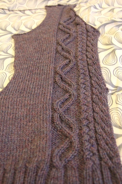 Sorry about the boring photo – the lighting around here sucks today. Anyway, I pinned it out for the photo, but I'll wait to block it with the other front, so they match.