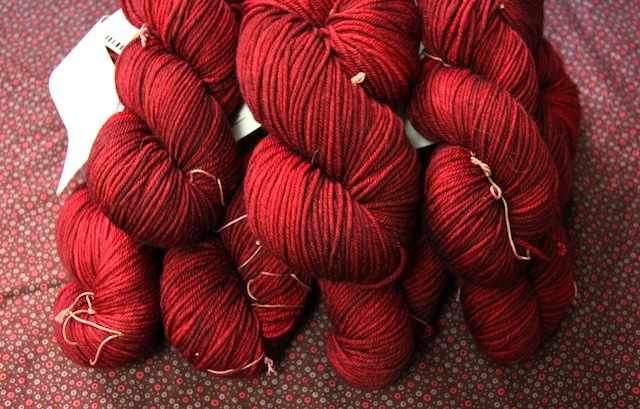 Seven skeins of Tosh Vintage in Tart, more than enough for any sweater I want to knit.