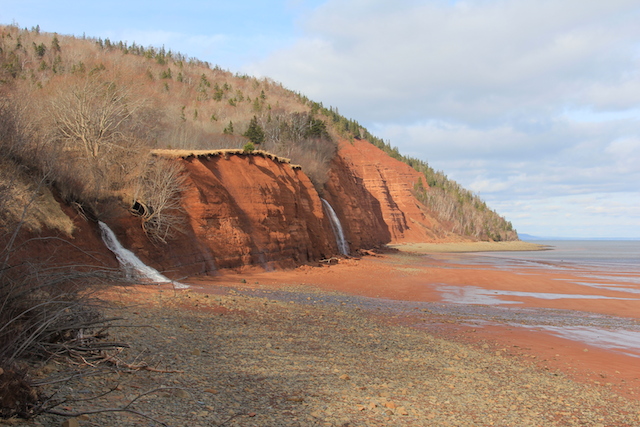 We walked along the beach for a little while and, despite the sun, it was freezing. The point up ahead is the very tip of the mountain (which looks like a peninsula from farther away).