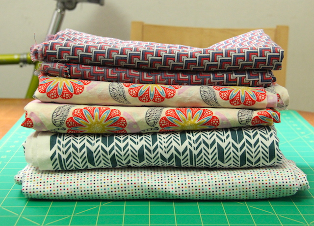 This pile of fabric represents (I hope) three tops and a dress. 